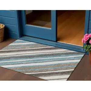 Photo of Taupe Ivory And Blue Striped Washable Indoor Outdoor Area Rug