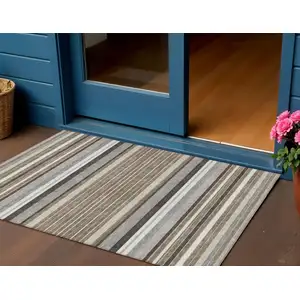 Photo of Taupe Ivory And Brown Striped Washable Indoor Outdoor Area Rug