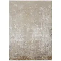 Photo of Taupe Ivory And Gold Abstract Power Loom Distressed Area Rug With Fringe