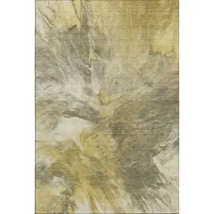 Photo of Taupe Ivory And Gold Abstract Washable Area Rug With UV Protection