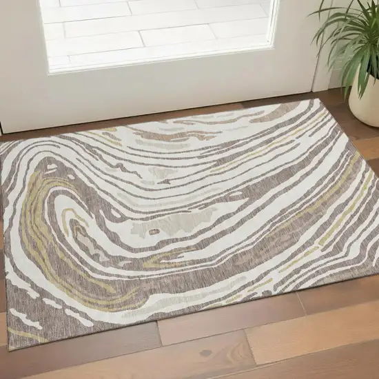 Taupe Ivory And Gold Abstract Washable Area Rug With UV Protection Photo 1