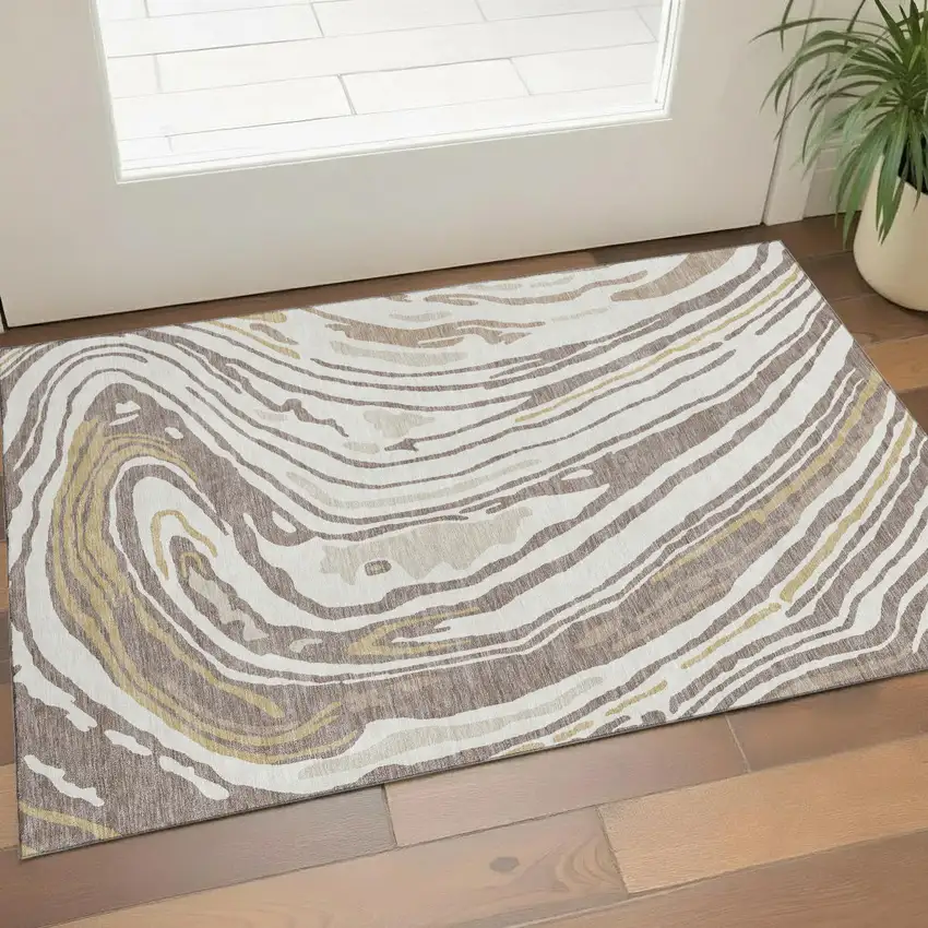 Taupe Ivory And Gold Abstract Washable Area Rug With UV Protection Photo 1