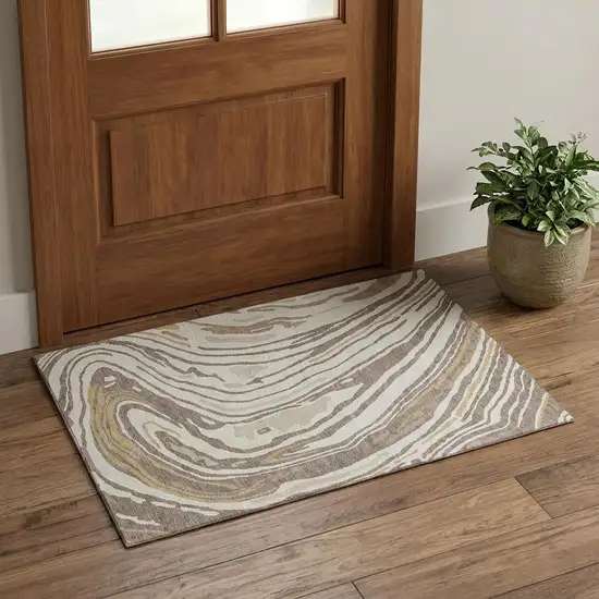 Taupe Ivory And Gold Abstract Washable Area Rug With UV Protection Photo 1