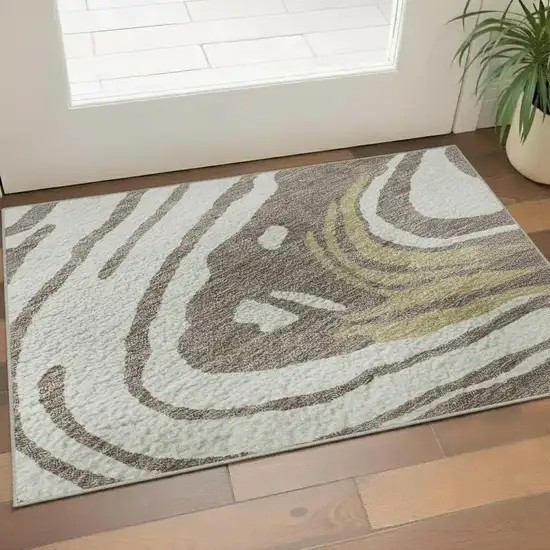 Taupe Ivory And Gold Abstract Washable Area Rug With UV Protection Photo 2