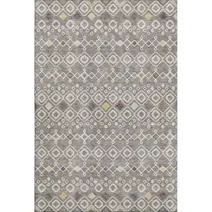 Photo of Taupe Ivory And Gold Southwestern Washable Area Rug With UV Protection