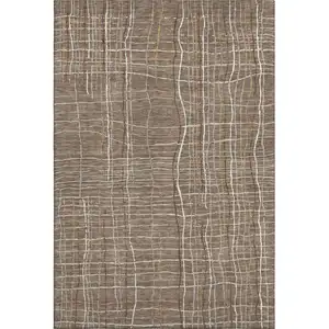 Photo of Taupe Ivory And Gold Striped Washable Area Rug With UV Protection