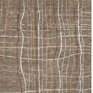 Photo of Taupe Ivory And Gold Striped Washable Area Rug With UV Protection