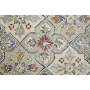 Photo of Taupe Ivory And Red Wool Patchwork Tufted Handmade Stain Resistant Area Rug