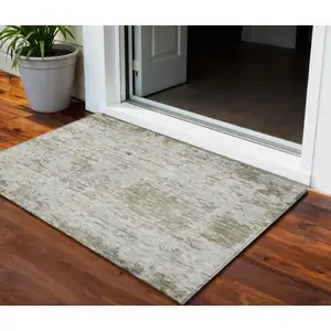 Photo of Taupe Light Yellow And Ivory Abstract Washable Indoor Outdoor Area Rug