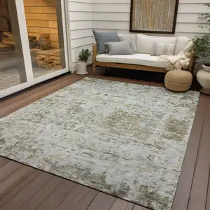 Photo of Taupe Light Yellow And Ivory Abstract Washable Indoor Outdoor Area Rug
