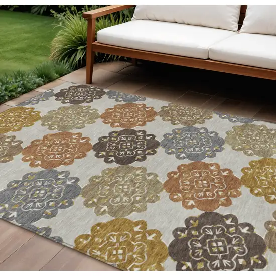 Taupe Orange And Ivory Quatrefoil Washable Indoor Outdoor Area Rug Photo 1