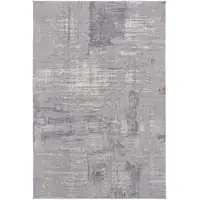 Photo of Taupe Tan And Blue Abstract Power Loom Distressed Stain Resistant Area Rug