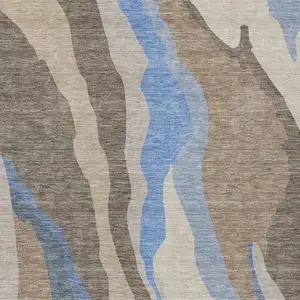 Photo of Taupe Tan And Blue Abstract Washable Indoor Outdoor Area Rug