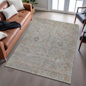 Photo of Taupe Teal And Coral Floral Washable Area Rug With UV Protection