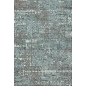 Photo of Taupe Teal And Ivory Geometric Washable Area Rug With UV Protection