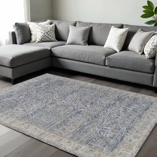 Blue Taupe And Ivory Ikat Distressed Area Rug With Fringe Photo 1