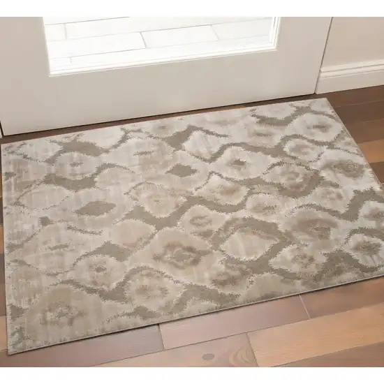 Taupe and Ivory Abstract Power Loom Worn Faded Area Rug Photo 1