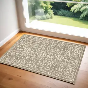 Photo of Taupe and Ivory Floral Area Rug