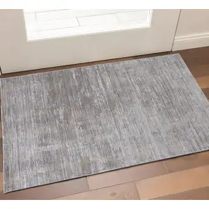Photo of Taupe and Silver Abstract Power Loom Worn Faded Area Rug