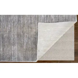 Photo of Taupe and Silver Abstract Power Loom Worn Faded Area Rug