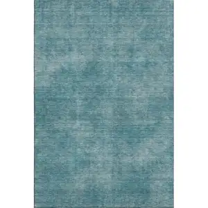 Photo of Teal And Aqua Abstract Washable Area Rug With UV Protection