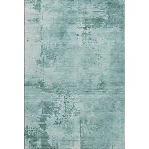 Photo of Teal And Aqua Abstract Washable Area Rug With UV Protection
