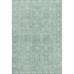 Photo of Teal And Aqua Geometric Washable Area Rug With UV Protection