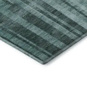 Photo of Teal And Aqua Striped Washable Area Rug With UV Protection