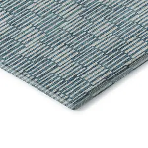 Photo of Teal And Beige Abstract Geometric Washable Area Rug With UV Protection