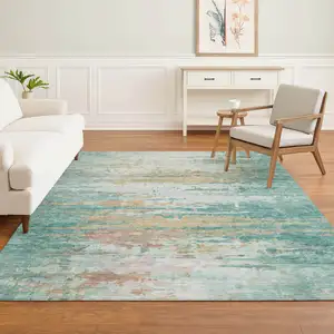 Photo of Teal And Beige Abstract Washable Area Rug With UV Protection
