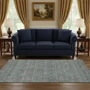 Photo of Teal And Beige Floral Washable Area Rug With UV Protection