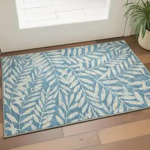 Photo of Teal And Beige Floral Washable Area Rug With UV Protection