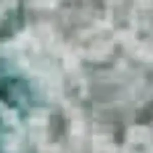 Photo of Teal And Beige Geometric Washable Area Rug With UV Protection