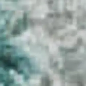 Photo of Teal And Beige Geometric Washable Area Rug With UV Protection