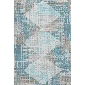 Photo of Teal And Beige Geometric Washable Area Rug With UV Protection