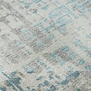 Photo of Teal And Beige Geometric Washable Area Rug With UV Protection