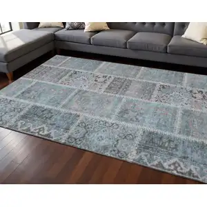Photo of Teal And Beige Patchwork Washable Area Rug With UV Protection