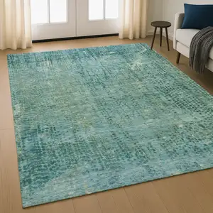 Photo of Teal And Blue Abstract Washable Area Rug With UV Protection