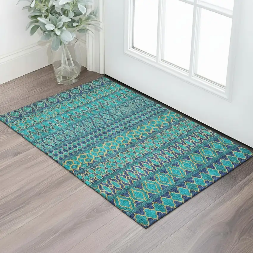 Teal And Gold Ikat Washable Area Rug With UV Protection Photo 1