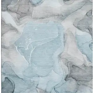 Photo of Teal And Gray Abstract Washable Area Rug With UV Protection
