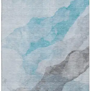 Photo of Teal And Gray Abstract Washable Area Rug With UV Protection