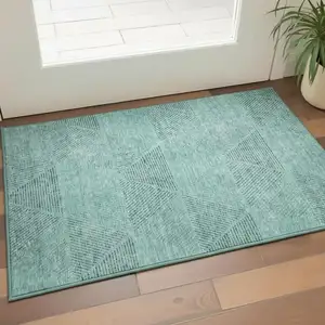 Photo of Teal And Gray Geometric Washable Area Rug With UV Protection