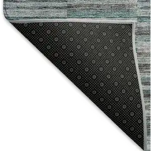 Photo of Teal And Gray Striped Washable Area Rug With UV Protection