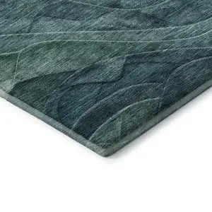 Photo of Teal And Green Abstract Washable Area Rug With UV Protection