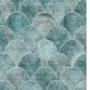 Photo of Teal And Ivory Abstract Geometric Washable Area Rug With UV Protection