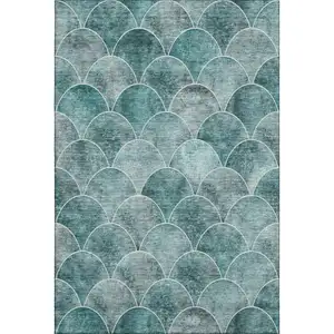 Photo of Teal And Ivory Abstract Geometric Washable Area Rug With UV Protection
