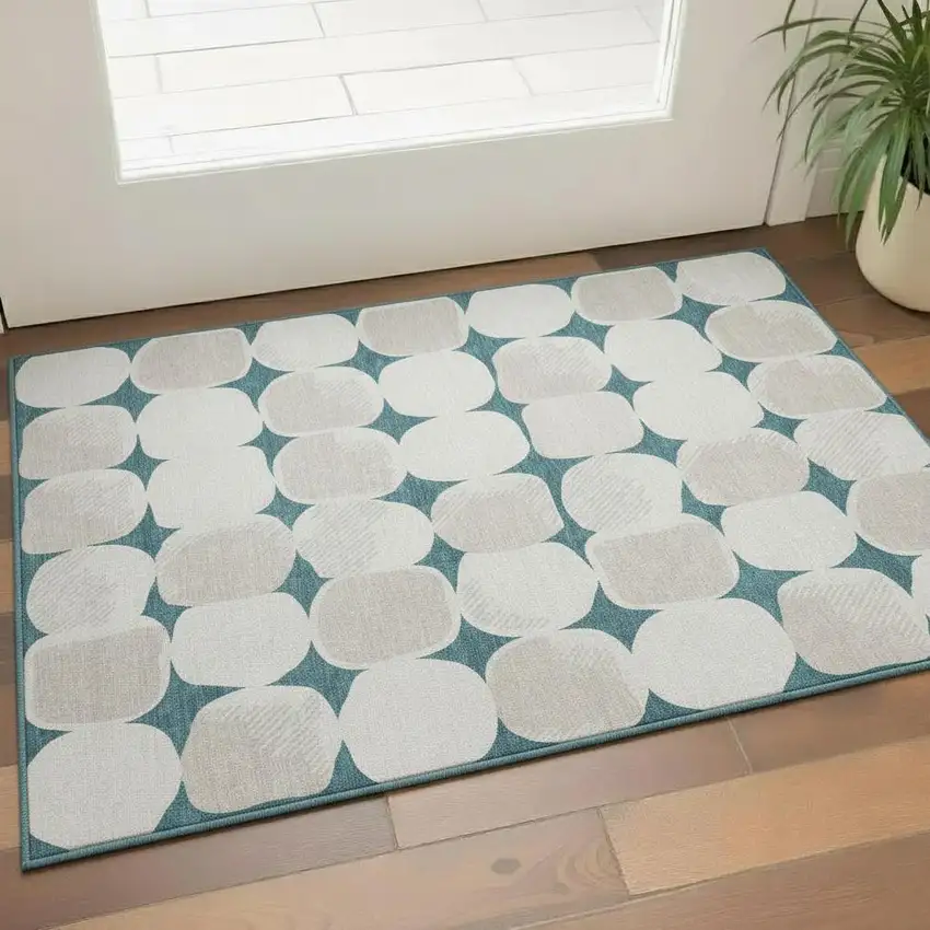 Teal And Ivory Abstract Geometric Washable Area Rug With UV Protection Photo 1