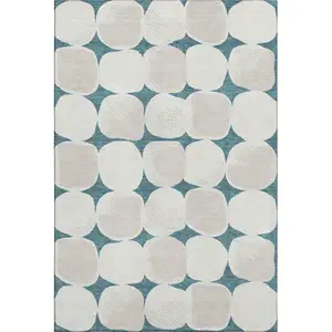 Photo of Teal And Ivory Abstract Geometric Washable Area Rug With UV Protection