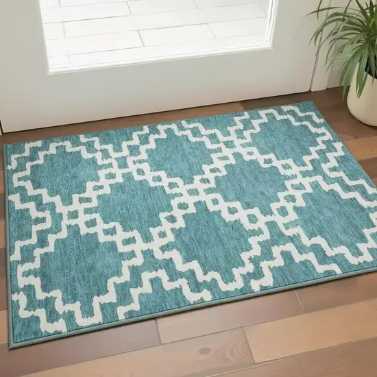 Teal And Ivory Abstract Geometric Washable Area Rug With UV Protection Photo 2