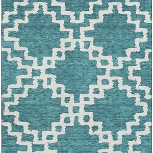 Photo of Teal And Ivory Abstract Geometric Washable Area Rug With UV Protection